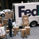 A FedEx Ground driver sorting packages in NYC in November 2019.